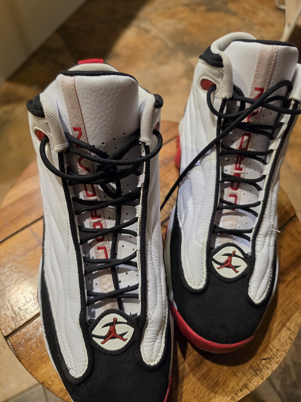 Men's Jordan Pro Strong High Top sneakers in the "White/Gym Red/Black"